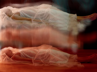 image of sleeper lying prone with blurred images of same floating above